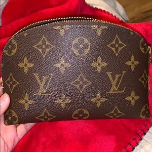 Louis Vuitton makeup pouch.